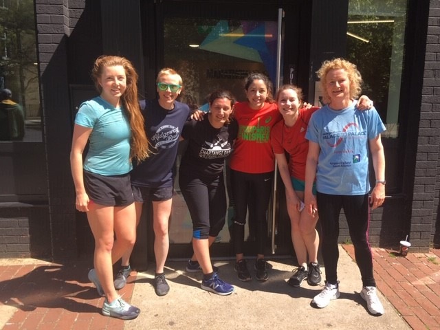 six happy women outside after running to improve wellbeing in the sunshine