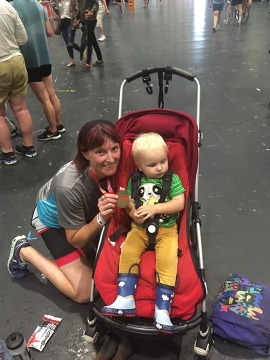 Clare with her son at the end of the London Triathlon.