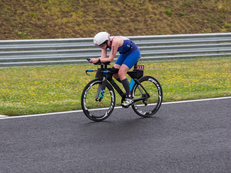 Jenni Anderson racing triathlon on her road bike